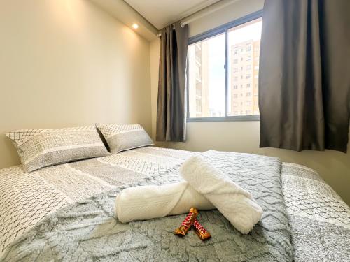 Ένα ή περισσότερα κρεβάτια σε δωμάτιο στο Apartamento moderno para até 4 pessoas Barra Funda