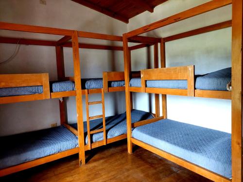 Двухъярусная кровать или двухъярусные кровати в номере CASA QUINTA LA ENCANTADA