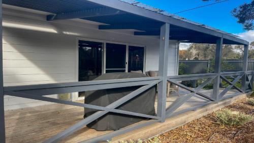 a screened porch with awning on a house at Just For 2 - A Fantastic Apartment - Perfect Coffin Bay Base For One or Two Guests in Coffin Bay
