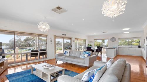 a living room with a couch and a table at Catch of the Bay in Coffin Bay
