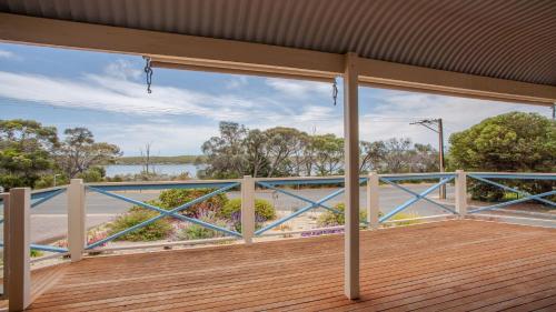 an empty deck with a view of the water at Catch of the Bay in Coffin Bay
