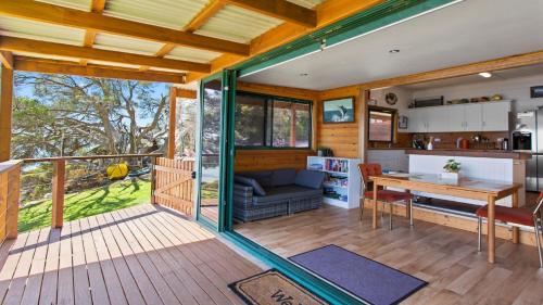 a living room and kitchen of a tiny house at Kellidie Bliss Is Coffin Bay's Touch Of Paradise - Perfect Couples Retreat in Coffin Bay