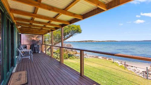 a balcony of a house with a view of the water at Kellidie Bliss Is Coffin Bay's Touch Of Paradise - Perfect Couples Retreat in Coffin Bay