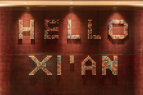 a sign that says xmas on a wall at Renaissance Xi'an Hotel in Xi'an