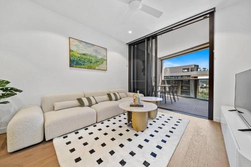 a living room with a couch and a table at 2BR Apt Lv 23 Queens Wharf Residence with Carpark - Privately Managed in Brisbane