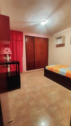 Ένα ή περισσότερα κρεβάτια σε δωμάτιο στο Céntrico Apartamento en Mérida