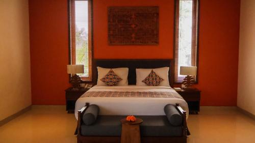 Postel nebo postele na pokoji v ubytování Kahayana Suites Ubud