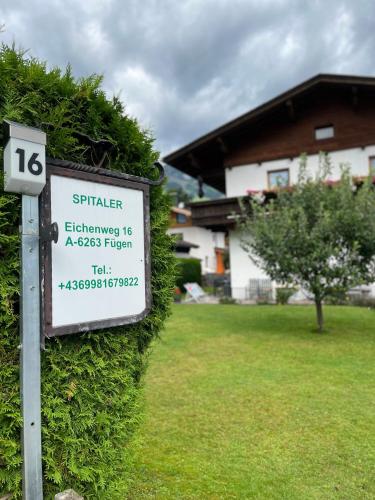 a sign in a yard next to a house at Ferienhaus Spitaler in Kleinboden