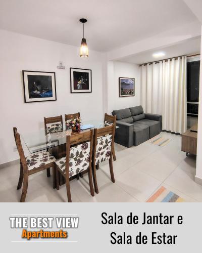 a living room with a table and a couch at The Best View in Angra dos Reis