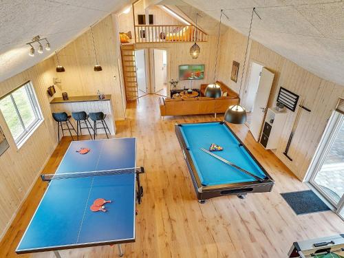 a large room with two ping pong tables in it at 5 star holiday home in Grenaa in Grenå