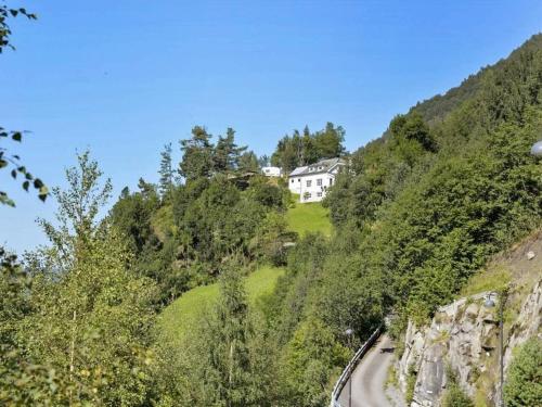 a house on the side of a hill at 10 person holiday home in Stordal in Stordal