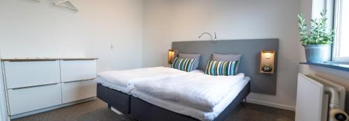 a bedroom with a large bed in a room at Refborg Hotel in Billund
