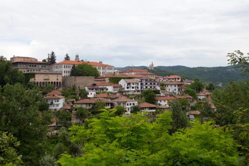 a cluster of houses on a hill with trees at Hotel Terazini in Veliko Tŭrnovo