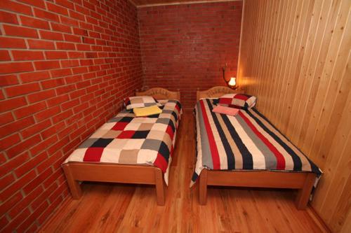 Katil atau katil-katil dalam bilik di Guest House Pilskalni