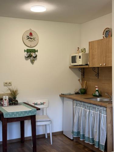a kitchen with a sink and a counter top at Chata Dolina v Bachledke in Ždiar