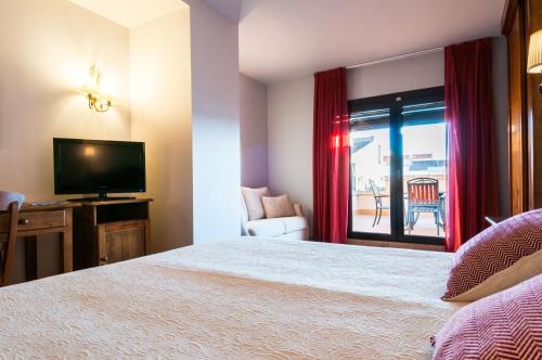 Кровать или кровати в номере Hotel Doña Manuela