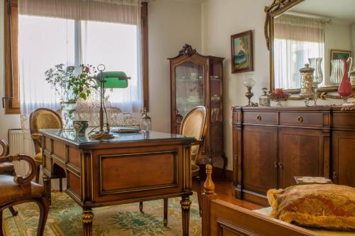 a room with a wooden table and a dresser at Luxury Villa Karteros in Karteros