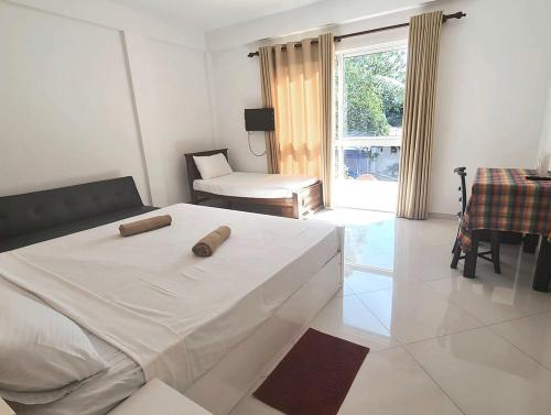 Postel nebo postele na pokoji v ubytování Hotel Good Life Unawatuna
