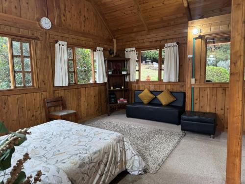 Una cama o camas en una habitación de Complejo Ecoturístico El Refugio