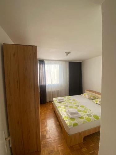 Una cama o camas en una habitación de Centar Travnik