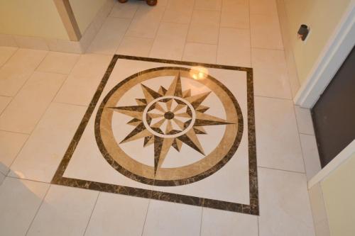 a tile floor with a wheel on it at The SoMa Furnished Residences in Hamilton