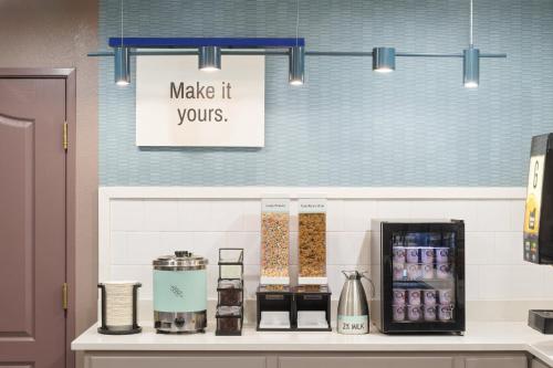 a counter with a sign that says make it yours at Garner Hotel Phoenix Northwest - Surprise by IHG in Surprise