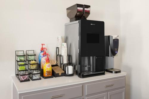 a coffee machine sitting on top of a counter at Garner Hotel Phoenix Northwest - Surprise by IHG in Surprise