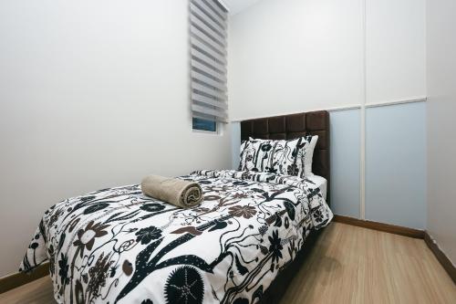 Postel nebo postele na pokoji v ubytování The Wave Residence Melaka in Malacca by Green Home