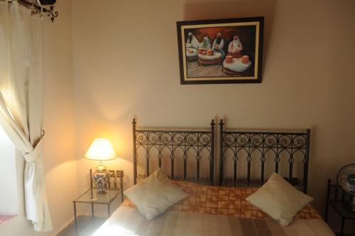 Auberge Chez Momo IIにあるベッド