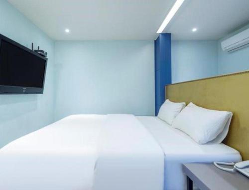 Ένα ή περισσότερα κρεβάτια σε δωμάτιο στο Hotel 7