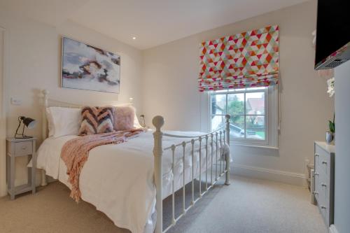 En eller flere senge i et værelse på Tillys Place