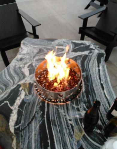a bowl with a fire in it on a table at Pier B Resort in Duluth