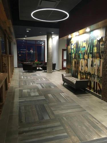 a lobby with a couch in the middle of a building at Pier B Resort in Duluth