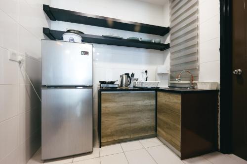 Kuchyň nebo kuchyňský kout v ubytování The Wave Residence Melaka in Malacca by Green Home