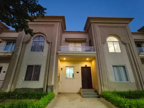 a large house with a door in front of it at Galaxy Villa Luxury 2BHK Stay in Jaipur
