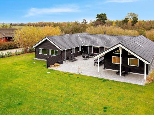 an overhead view of a black house with a yard at 22 person holiday home in Idestrup in Marielyst