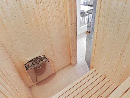 an overhead view of a wooden room with a toilet at Luxury Pool Retreat in Henne - By Traum Ferienwohnungen in Henne Strand