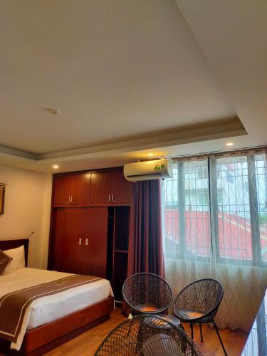 Ένα ή περισσότερα κρεβάτια σε δωμάτιο στο Camellia Hotel