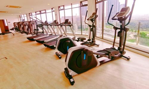 a row of treadmills in a gym with large windows at NearEcobotanic & Legoland-HappyMoonlight-2B2R-8px in Iskandar Puteri