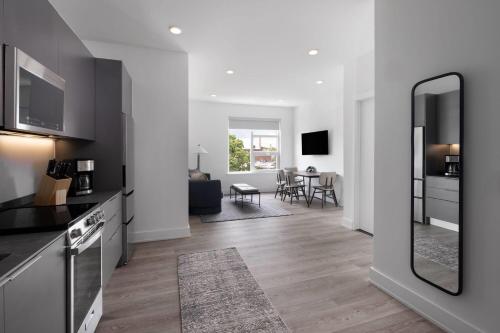 a living room with a kitchen and a dining room at Reside NoMa, a Wyndham Residence in Washington