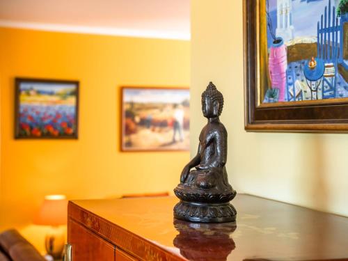 a black statue sitting on top of a table at Hillside Retreat in Roquebrun in Roquebrun