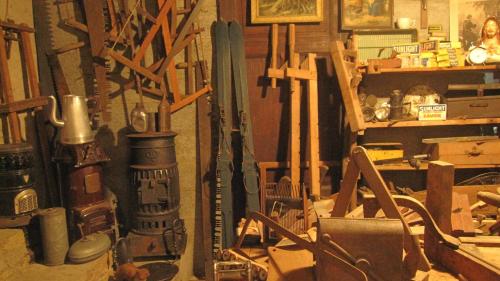 a room filled with lots of different types of tools at La Remise - Les Chambres in Neufchâteau