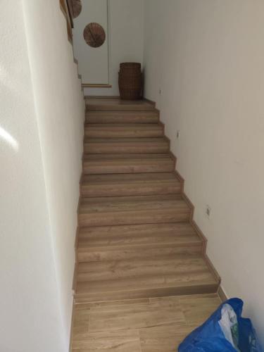 a hallway with a staircase with wood floors at Chata Myto pod Ďumbierom in Mýto pod Ďumbierom