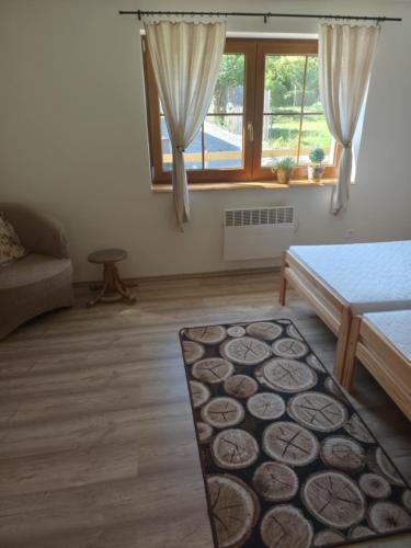a living room with a couch and a table at Chata Myto pod Ďumbierom in Mýto pod Ďumbierom