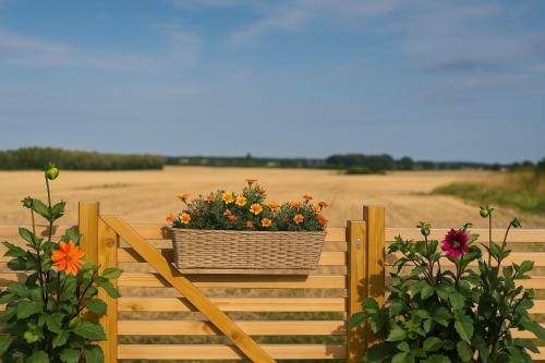 a basket of flowers on a wooden stairway at Private 3 BR Villa! Jacuzzi Fireplace Near Lund and Malmö in Kävlinge