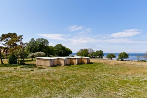 a row of tents in a field near the water at Visby Gustavsvik in Visby