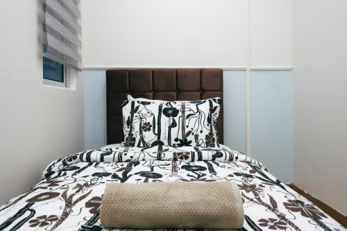 Postel nebo postele na pokoji v ubytování The Wave Residence Melaka in Malacca by Green Home