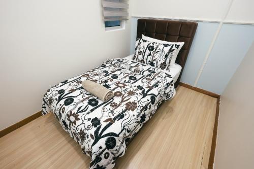 Postel nebo postele na pokoji v ubytování The Wave Residence Melaka in Malacca by Green Home