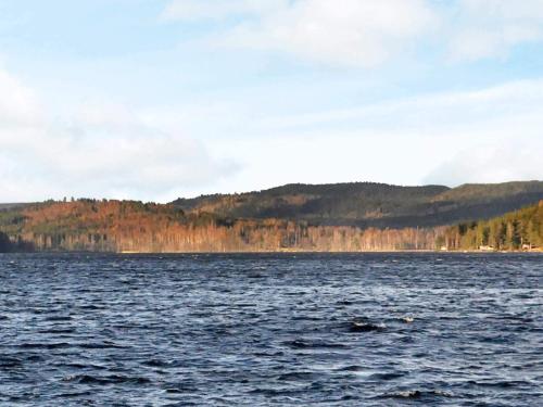 a large body of water with mountains in the background at 4 person holiday home in Ulfborg-By Traum in Fengersfors