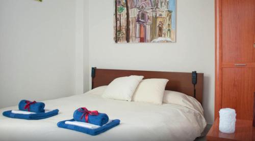 Un pat sau paturi într-o cameră la Atico Cadiz